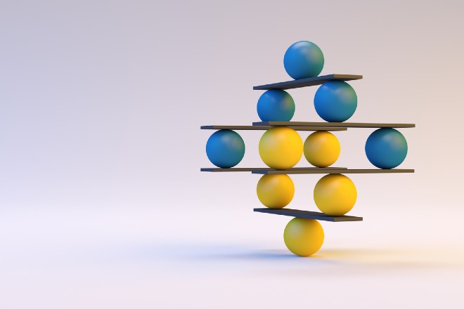 Colorful balls balanced atop each other