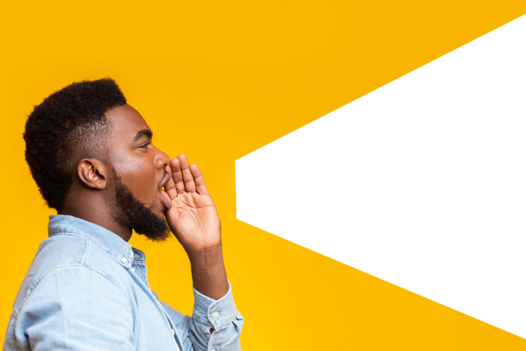 Young Black professional making an announcement against a yellow background.