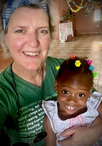 Julia Gabriele with a child on board the Mercy Ship