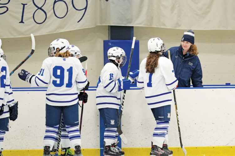 Image of Zoe Schwam coaching hockey at Portledge School